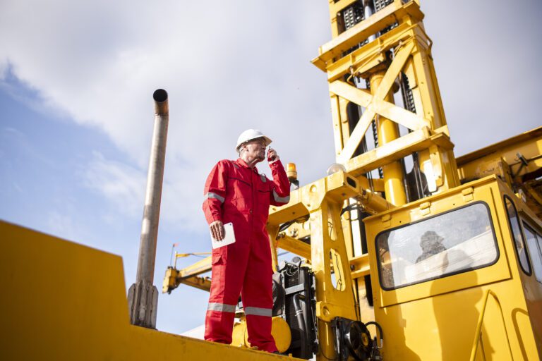 engineer-or-worker-standing-forklift-or-truck-vehi-2025-03-14-11-38-15-utc